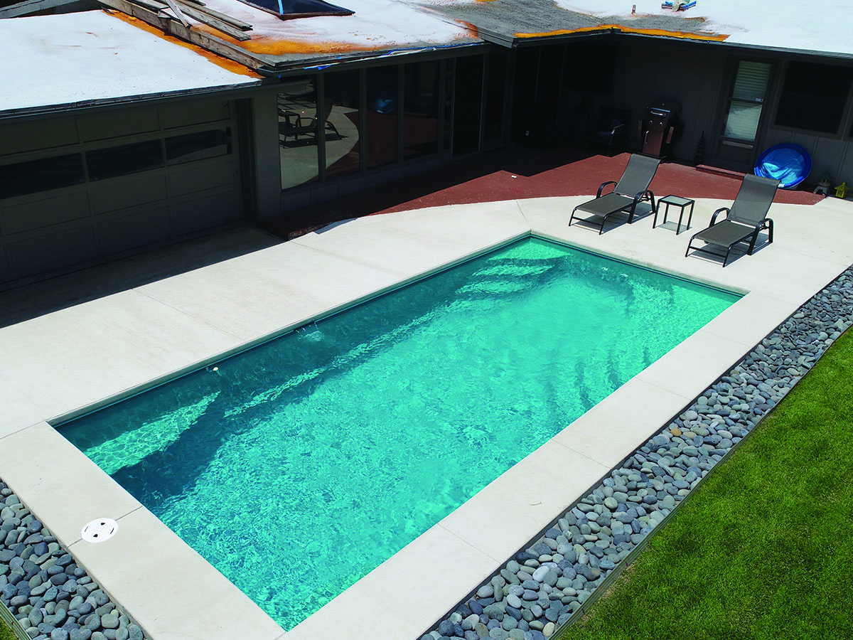 Beautiful blue swimming pool completed by Copano Pools and Spas